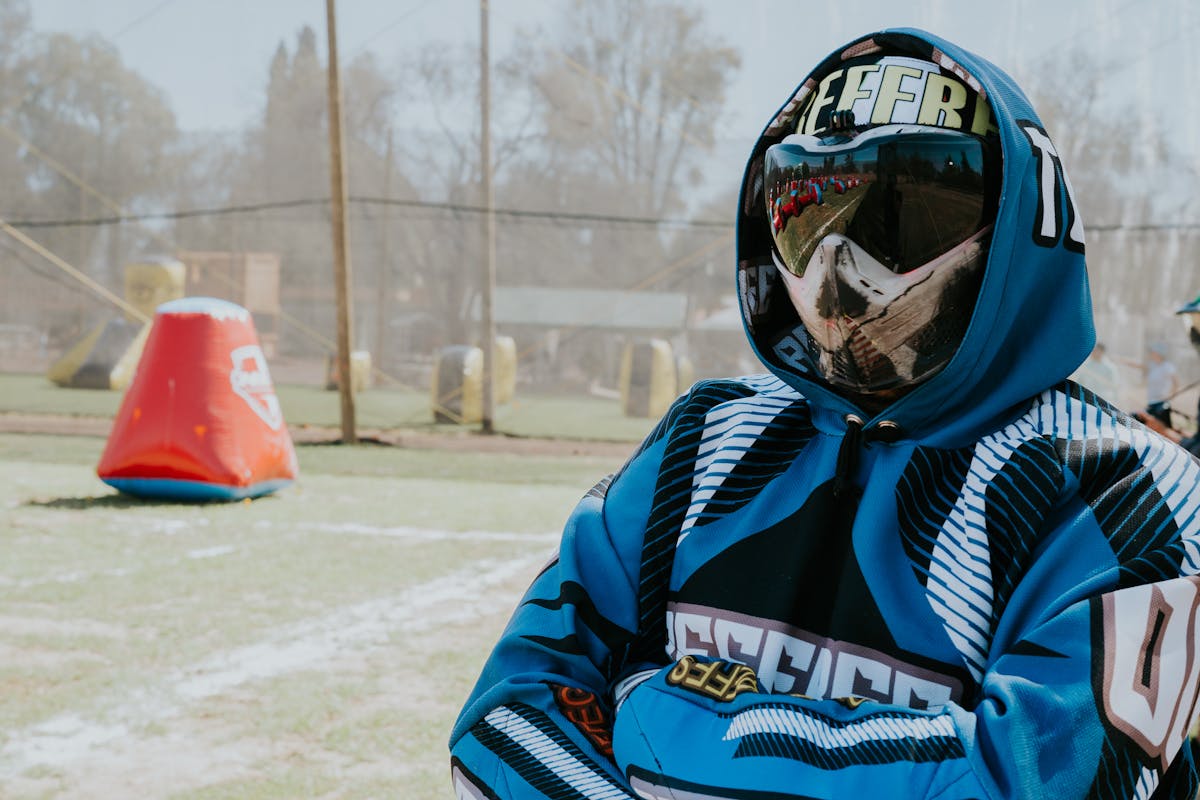 Players competing under illuminated field lights during Nightball